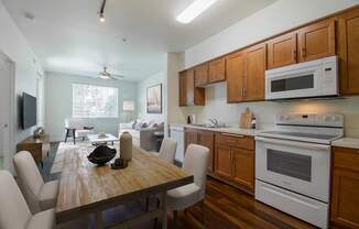 a kitchen and dining area in a 555 waverly unit