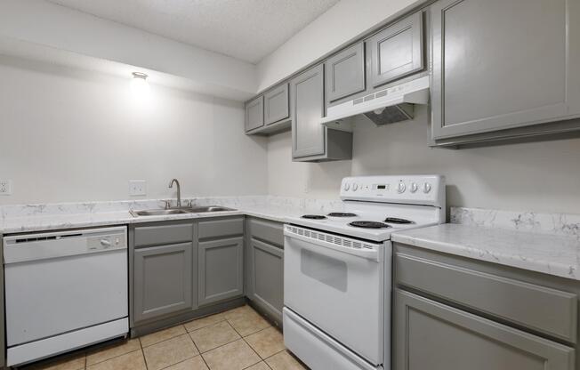 a kitchen with a stove top oven