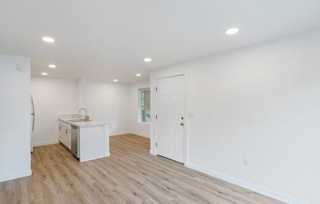 a kitchen and living room in a 555 waverly unit