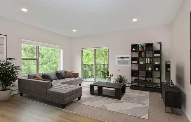 a living room with a couch coffee table and bookshelf