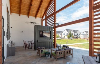 a living room with a tv and a patio