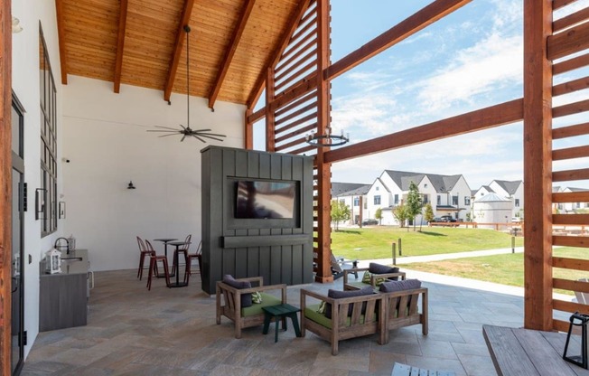 a living room with a tv and a patio