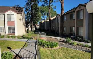 Walkway between building complexes at Northwood Apartments in Upland, California.