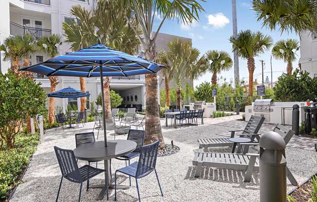 Outdoor courtyard with grills and seating at The Foundry Luxury Apartments in Tampa FL