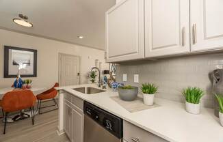 Kitchen with white cabinets at Woodbridge Villas Apartments, Sachse, 75048