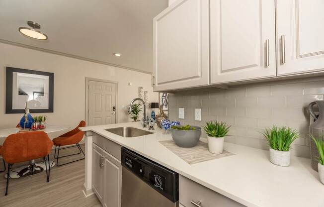 Kitchen with white cabinets at Woodbridge Villas Apartments, Sachse, 75048