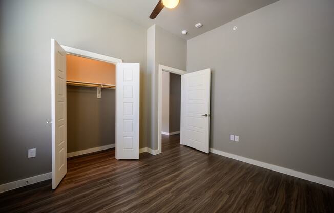 Harmony Luxury Apartments bedroom with tall ceilings and natural lighting