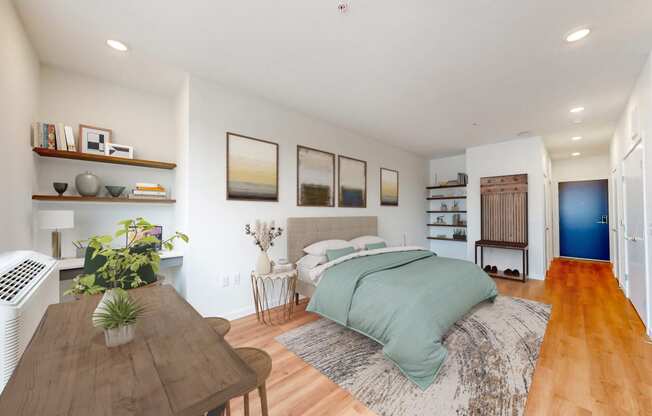 a bedroom with a bed and a wooden table