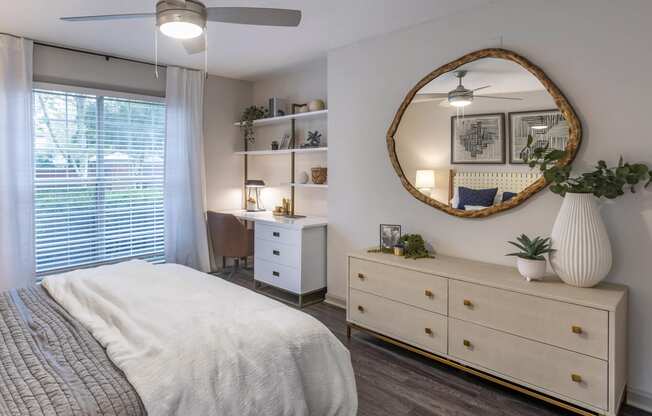 a bedroom with a bed and a mirror at Roswell Village, Roswell, Georgia
