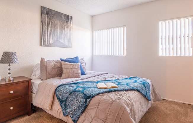 El Encanto second bedroom with nice natural lighting and carpet flooring
