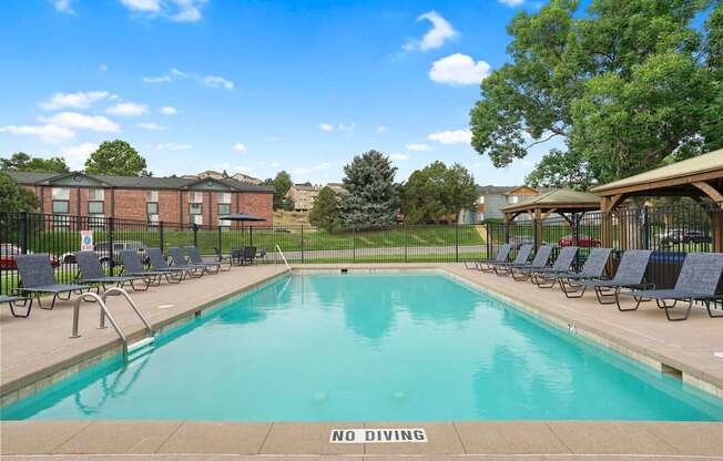 A pool with a NO DIVING sign in the foreground at Mountain Vista Apartments, Colorado, 80228