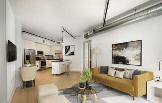 a living room with a yellow couch and a table