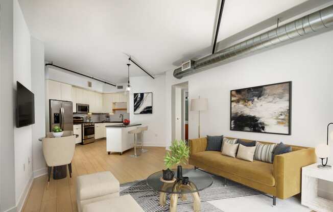 a living room with a yellow couch and a table