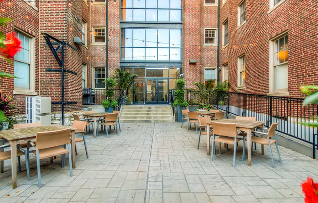 York House open courtyard with multiple tables and chairs at York House, Saint Louis, MO