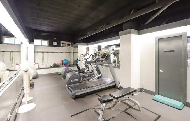 fitness center with work out machines at the baystate apartments in washington dc
