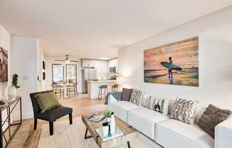 a living room with a couch and a coffee table at The Meadows Apartments, Culver City , CA 90230