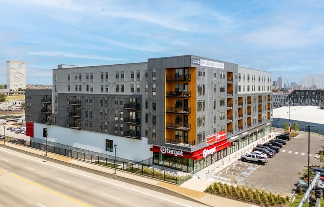 an aerial view of an apartment building and a parking lot