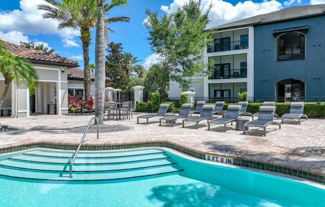 a swimming pool and sundeck at Verano apartments