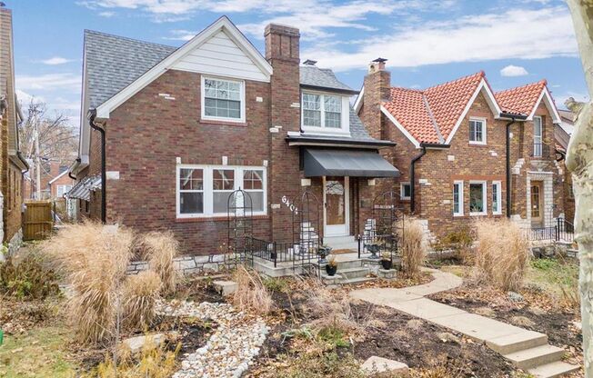 This charming gingerbread home in St. Louis Hills blends modern updates with classic appeal.