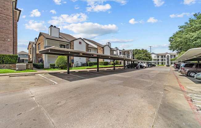 A parking lot with a building in the background.