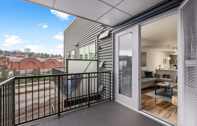 a balcony with a view of a city and a balcony fence