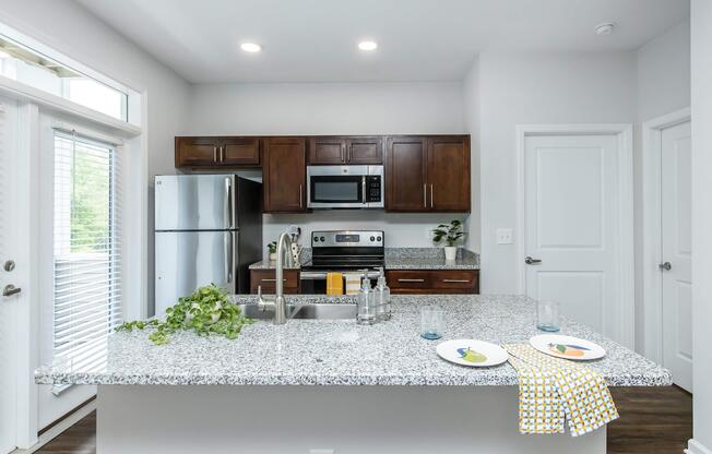 a modern kitchen with an island in the middle of a room