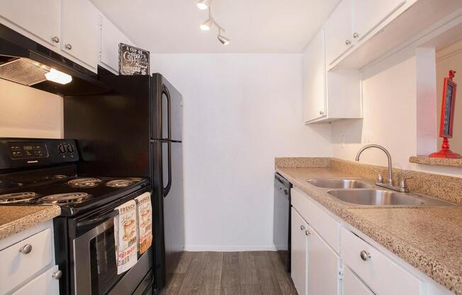 a large kitchen with stainless steel appliances