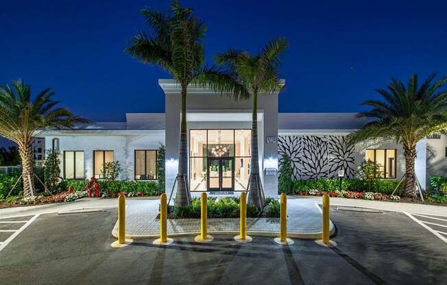 A modern building with a palm tree in front.