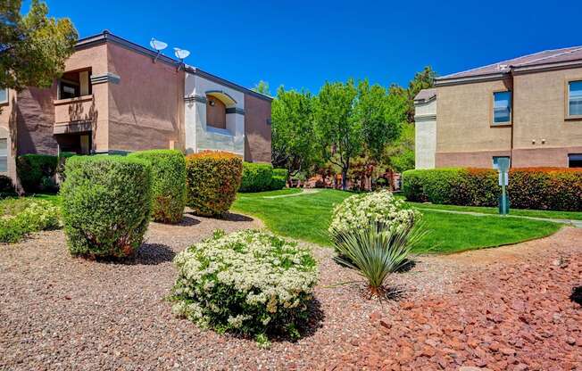 A well-maintained garden in front of a building.