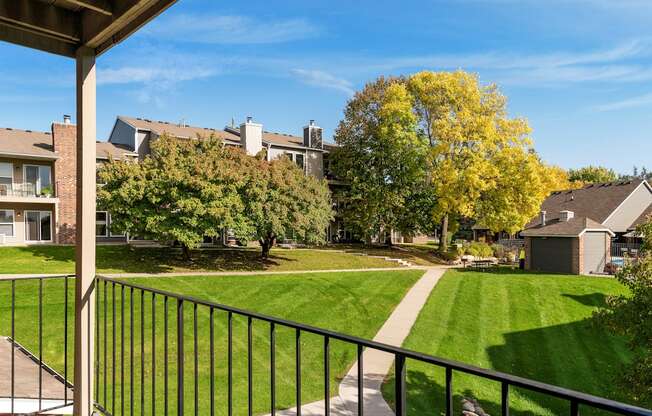 Balcony overlooking the grounds and walking paths at Eden Commons in Eden Prairie, MN 55