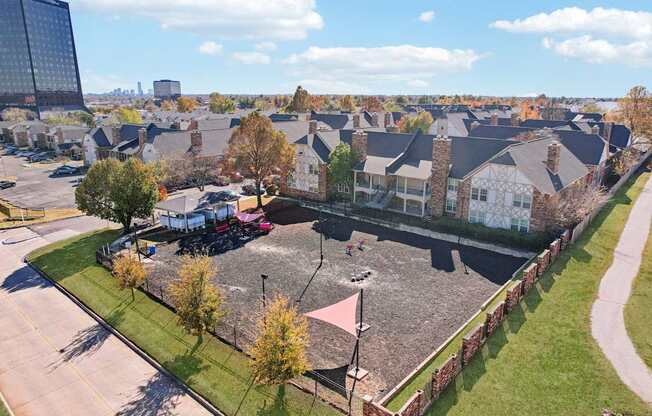A view of a residential area with houses and a parking lot.