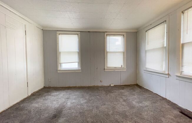 Fall into this cozy 3-Bedroom Home with a fenced in yard & detached garage!