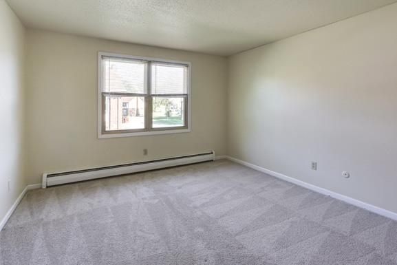 the living room of an empty house with a window