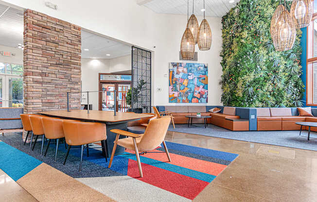 a conference room with a table and chairs and a green wall