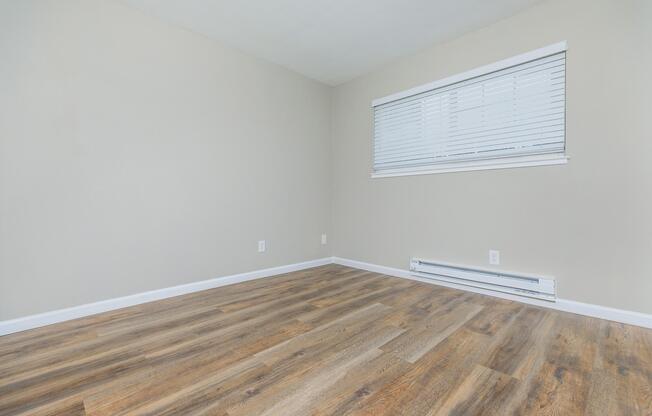 a bedroom with a large window