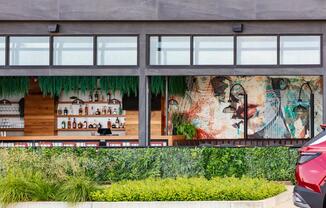 Grab a refreshing beverage and soak in the atmosphere at this vibrant local bar, just minutes from your doorstep.