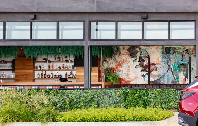 Grab a refreshing beverage and soak in the atmosphere at this vibrant local bar, just minutes from your doorstep.