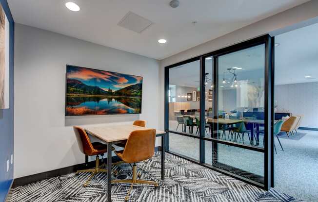 a conference room with glass doors and a table with chairs