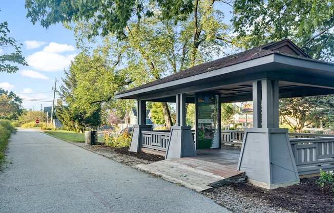 a covered pavilion on the side of a road