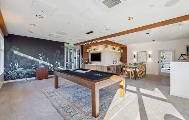 a game room with a pool table and a television