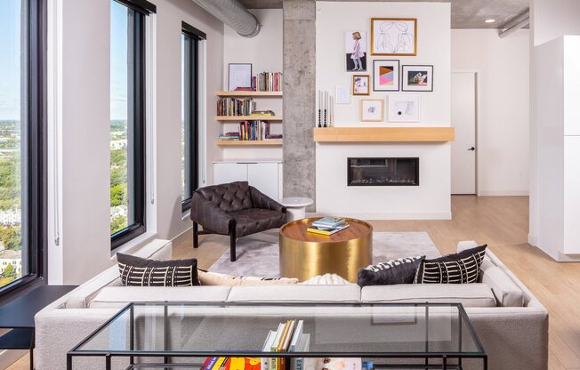 Penthouse living room with built-in shelving and fireplace