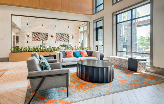 a living room with couches and chairs and a coffee table