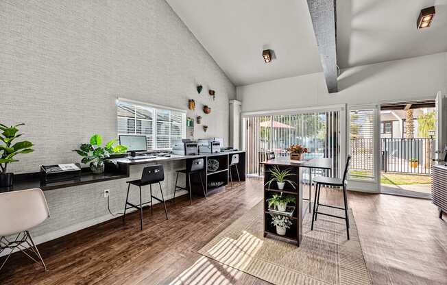 A modern kitchen with a dining table and chairs.