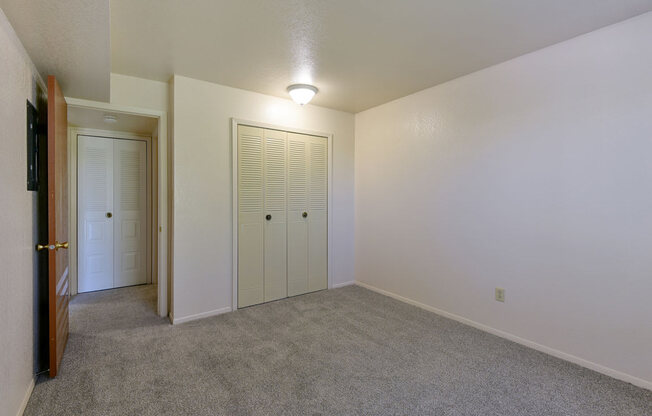 Bedroom with Large Closet at Old Monterey Apartments, Missouri, 65807 at Old Monterey Apartments, Missouri, 65807