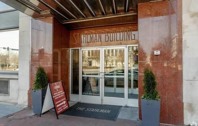 The entrance to the Silverman Building with a sign on the ground.