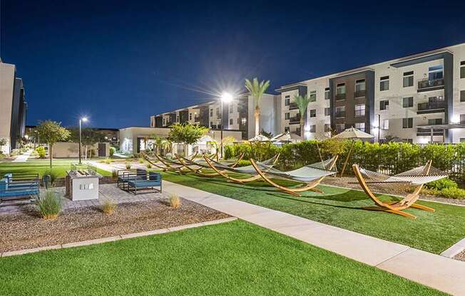 Outdoor Fire Pit Area with Hammocks at Glen 91 Apartments located in Glendale, AZ.