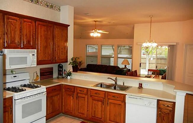 This meticulously maintained, smoke-free home offers an exceptional layout with soaring high ceilings, extensive tile flooring, and fresh neutral paint throughout.