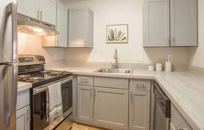 Kitchen with stainless steel appliances and white cabinets