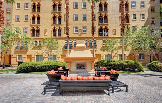 A large building with a courtyard in front of it.