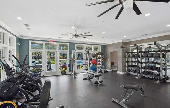 Community Fitness Center with Equipment at Fountains Lee Vista Apartments in Orlando, FL.